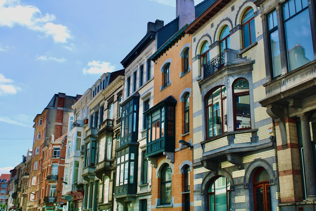 Row of townhouses in Belgium, where planning for the Belgian exit tax starts before the move to Spain